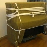 鋼琴包裝後才搬運